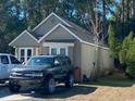 Well-maintained home featuring an attached garage, front driveway and manicured lawn at 1061 Valley Dr., Calabash, NC 28467