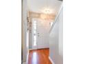 Bright entryway featuring hardwood floors, a white door with sidelights, and neutral wall paint at 1155 Harvester Circle # 1155, Myrtle Beach, SC 29579