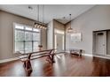 Open-concept living and dining area with high ceilings and hardwood floors at 130 Maiden Ln., Myrtle Beach, SC 29588