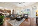 Open-concept living room featuring hardwood floors, comfortable seating, and lots of natural light at 2122 Silver Spring Ln., Myrtle Beach, SC 29577