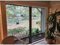 Large windows give great view of the back yard and pond at 219 Salt Marsh Circle # 14A, Pawleys Island, SC 29585