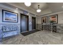 View of an elevator lobby, which features tile floors, overhead lighting, and an elegant waiting bench at 2307 S Ocean Blvd. # 5A, North Myrtle Beach, SC 29582