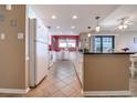 Galley kitchen features a breakfast bar, white appliances, and plenty of space for cooking and entertaining at 2307 S Ocean Blvd. # 5A, North Myrtle Beach, SC 29582