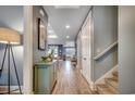 Hallway features wood flooring, neutral paint, white doors, and access to multiple rooms at 2381 Tidewatch Way, North Myrtle Beach, SC 29582