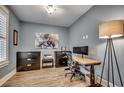 Home office with natural light, wood floors, and black filing cabinets at 2381 Tidewatch Way, North Myrtle Beach, SC 29582