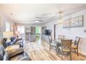 Bright open living space with hardwood floors, dining area, and comfortable furnishings at 308 24Th Ave. N, North Myrtle Beach, SC 29582