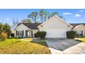 Inviting home exterior with a two-car garage and well-kept landscaping, set in a serene neighborhood at 1501 Hallborough Dr., Surfside Beach, SC 29575