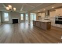 Open floor plan featuring a spacious living room, modern kitchen, and stunning hardwood floors at 4019 Bucolic Loop, Myrtle Beach, SC 29588