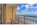 Relaxing balcony with chairs and a table overlooking the ocean at 6900 N Ocean Blvd. # 1139, Myrtle Beach, SC 29572