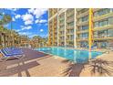 Refreshing pool with lounge chairs, perfect for relaxation at 6900 N Ocean Blvd. # 1139, Myrtle Beach, SC 29572