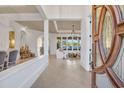 Elegant foyer featuring tile flooring, decorative columns, and an open view to the living room at 8068 Cortona Dr., Myrtle Beach, SC 29572