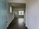 Open-concept living room showcasing hardwood floors and bright natural light at 1001 Cavaletti Ct., Myrtle Beach, SC 29588