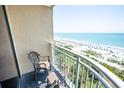 Balcony area complete with furniture overlooking the ocean at 2106 N Ocean Blvd. # 712, Myrtle Beach, SC 29577