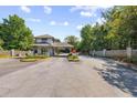 Community entrance featuring a guard house, gate, landscaping and brick fencing at 2557 Pete Dye Dr. # 402, North Myrtle Beach, SC 29582