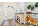 Bright entryway featuring a decorative cabinet and an arched front door at 2724 A C Ln, Conway, SC 29526
