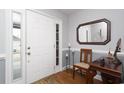 Bright foyer featuring wood floors and a stylish mirror at 304 Canyon Dr., Conway, SC 29526
