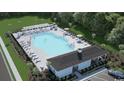 Community pool with sun loungers and shaded seating areas at 369 Myrtle Meadows Dr # 417C, Conway, SC 29526
