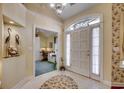 Bright foyer with a large arched window and a view of a home office space at 4494 Aberdeen Way, Myrtle Beach, SC 29579