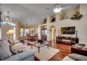 Open-concept living room with hardwood floors and vaulted ceilings at 4494 Aberdeen Way, Myrtle Beach, SC 29579