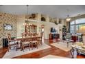 Spacious living room featuring hardwood floors, large windows, and a dining area at 4494 Aberdeen Way, Myrtle Beach, SC 29579