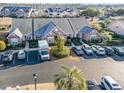 A birdseye view of the townhouse complex with parking and meticulous landscaping at 4535 Lightkeepers Dr. # 27B, Little River, SC 29566