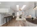 Bright and open living space with modern decor, seamlessly flowing into the kitchen at 4535 Lightkeepers Dr. # 27B, Little River, SC 29566