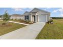 Cozy single-story home with a well-maintained lawn and a neatly paved driveway at 457 Acosta Circle, Conway, SC 29527