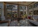 Cozy screened porch with comfortable seating, ideal for relaxation and enjoying the outdoor views at 48 Twelve Oaks Dr. # 3, Pawleys Island, SC 29585