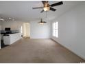Spacious living room featuring neutral carpet, ceiling fans, and abundant natural light at 528 Banks Dr. # 2-4 & 2-4G, Myrtle Beach, SC 29588