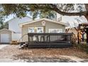 Charming gray beach house with string lights, picnic table, and outdoor deck for relaxing at 6001 - 1828A S Kings Hwy., Myrtle Beach, SC 29575