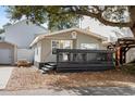 Charming gray beach house with string lights, picnic table, and outdoor deck for relaxing at 6001 - 1828A S Kings Hwy., Myrtle Beach, SC 29575