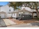 Charming gray beach house with string lights, picnic table, and outdoor deck for relaxing at 6001 - 1828A S Kings Hwy., Myrtle Beach, SC 29575