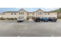 Exterior of condominium with ample parking including accessible parking at 8538 Hopkins Circle # E, Surfside Beach, SC 29575