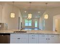 Open-concept kitchen with an island that overlooks the living area, perfect for entertaining at 8643 Farrier Dr., Myrtle Beach, SC 29588