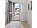 Inviting foyer with tile flooring and decorative glass door leading to the outside at 1024 Dizzy Ct., Surfside Beach, SC 29575