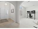 Bright room with arched doorway, natural light, and modern computer workstation at 1024 Dizzy Ct., Surfside Beach, SC 29575