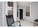 Cozy front porch featuring a rocking chair and a view of the home's entrance at 1517 Palmina Loop # B, Myrtle Beach, SC 29588