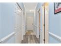 Bright hallway featuring ample storage, neutral paint, and modern flooring with easy access to rooms at 1537 Lanterns Rest Rd. # 202, Myrtle Beach, SC 29579