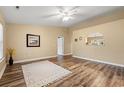 The open-concept living room features hardwood floors, neutral paint, and ample natural light from the window at 177 Reef Run Rd., Pawleys Island, SC 29585