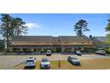 Elevated view of townhomes, with a focus on parking and landscaping at 1851 Fairway Ridge # 7C, Surfside Beach, SC 29575