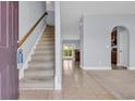 Bright foyer with tiled floors and staircase leading to the second floor at 228 Gresham Ln., Myrtle Beach, SC 29588