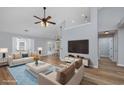 Bright living room with contemporary decor, wood floors, and large windows for natural light at 229 Duchess Ct., Myrtle Beach, SC 29588