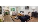 Bright living room with a jute rug, modern furnishings, and a sliding door to the outside at 448 Ribbon Rail Way, Loris, SC 29569