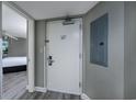 Hallway leading to a bedroom with wood flooring and a gray painted walls at 5200 N Ocean Blvd. # 155, Myrtle Beach, SC 29577