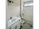 Neutral bathroom with a single sink vanity, framed mirror, and a shower-tub combo with black hardware at 5374 Hampton Rd., Conway, SC 29527