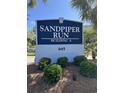 Sandpiper Run Building A sign at 645 with lush greenery at 645 Retreat Beach Circle, Pawleys Island, SC 29585