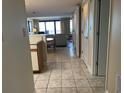 Inviting living room with tiled floors that lead to an outdoor balcony at 645 Retreat Beach Circle, Pawleys Island, SC 29585