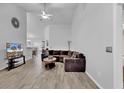 Spacious living room featuring vaulted ceilings, wood floors and a comfortable sectional sofa at 7228 Guinevere Circle, Myrtle Beach, SC 29588