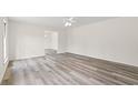 Spacious living room featuring new flooring, neutral paint and a ceiling fan at 83 Pond St., Georgetown, SC 29440