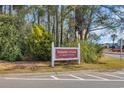 Palmetto Greens at Colonial Charters community sign surrounded by lush landscaping at 309 Lake Mist Ct. # 309, Longs, SC 29568